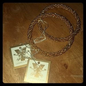 Two gold tone Gerard yosca bangle bracelets